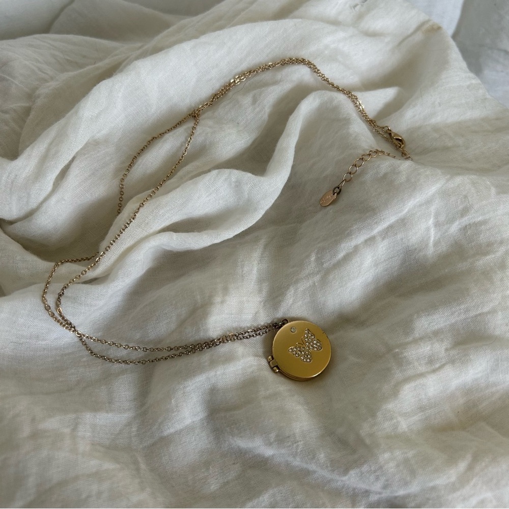 Gold butterfly locket